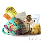 Spiritual gift box with incense, incense holder, mug, honey, tea, and notebook