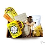 Spiritual gift box with incense, incense holder, mug, honey, tea, and notebook